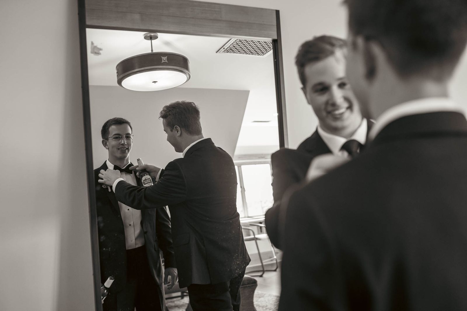 Groom and his groomsmen in the doorway before the ceremony — black and white — Sylvanside Farm wedding in Purcellville, Virginia