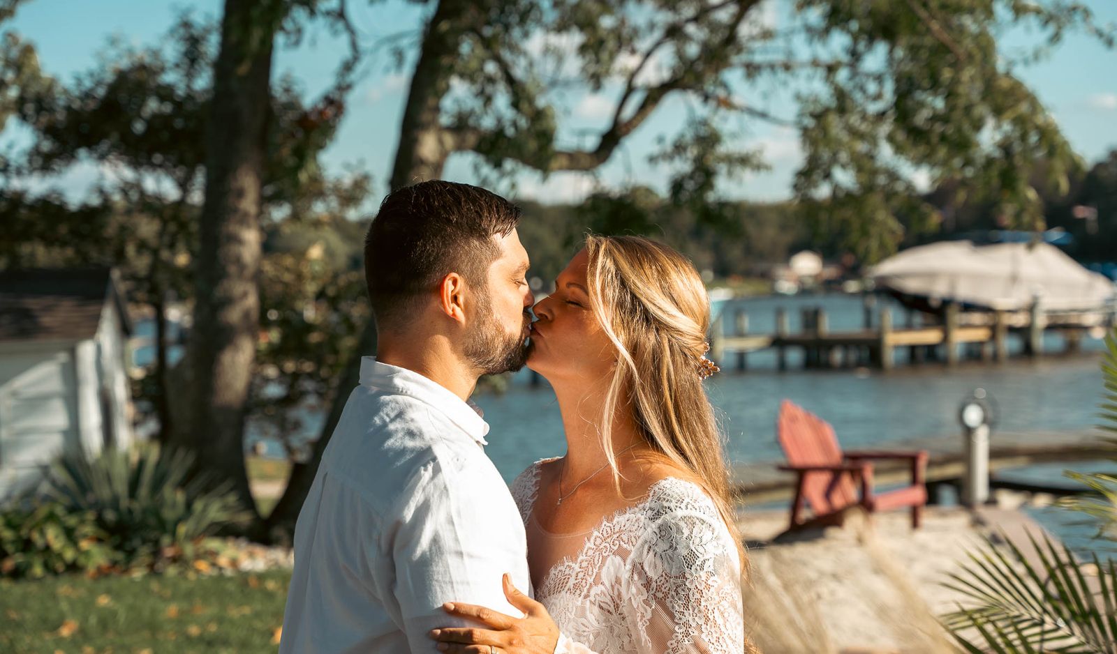 First look on the lawn above the creek — backyard wedding in Annapolis, Maryland