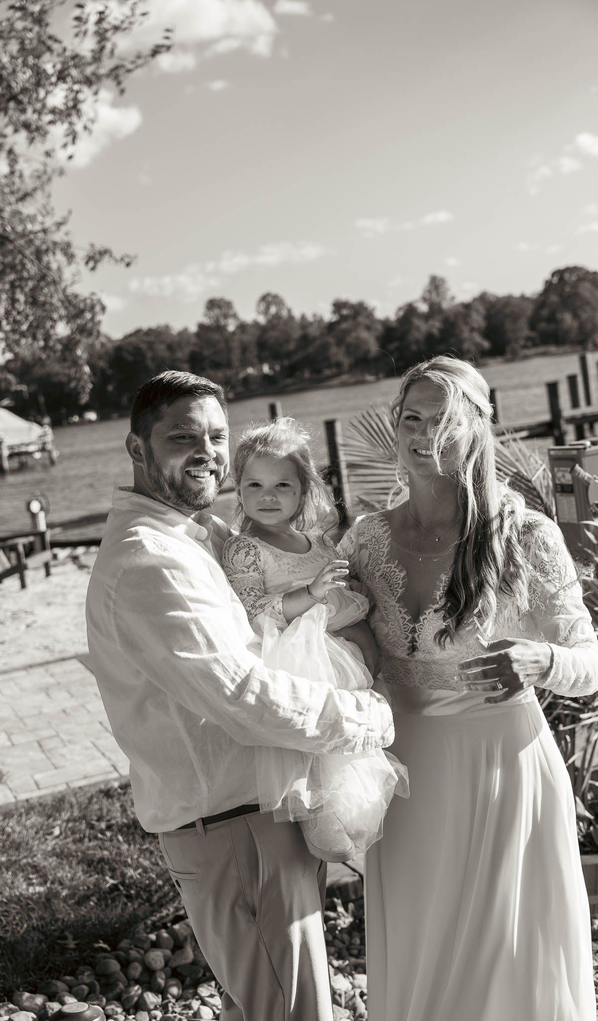 First look on the lawn above the creek — backyard wedding in Annapolis, Maryland